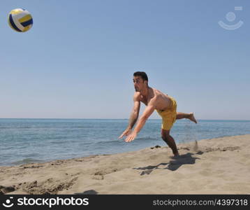 male beach volleyball game player jump on hot sand