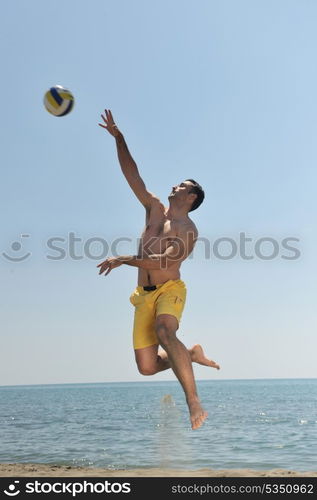 male beach volleyball game player jump on hot sand