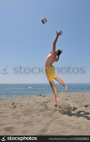 male beach volleyball game player jump on hot sand