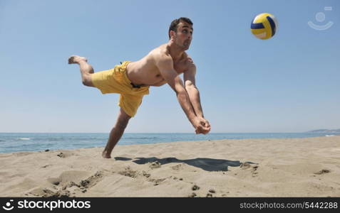 male beach volleyball game player jump on hot sand