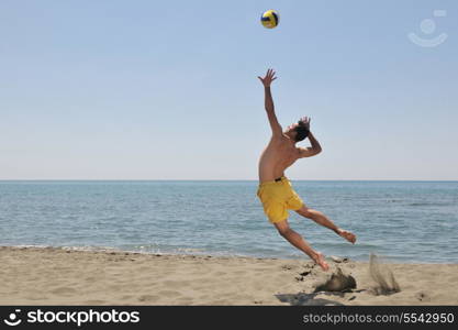 male beach volleyball game player jump on hot sand