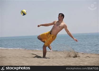 male beach volleyball game player jump on hot sand