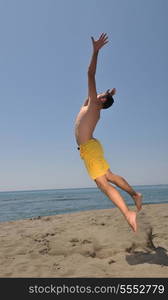 male beach volleyball game player jump on hot sand