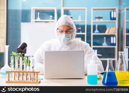 Male biotechnology scientist chemist working in the lab