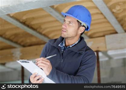 male builder is preparing a reparation quote