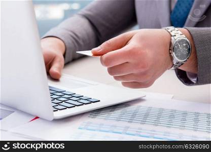 Male businessman doing online shopping with credit card