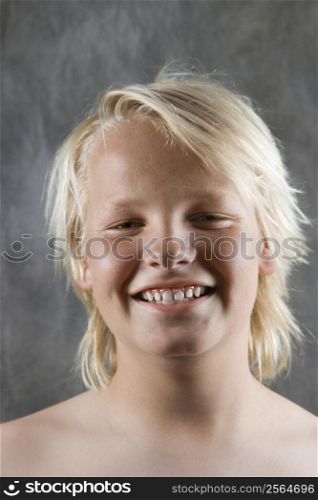 Male Caucasian adolescent portrait smiling.