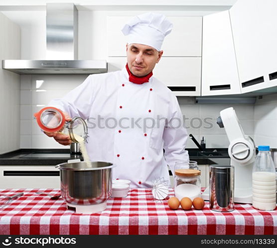 Male chef at kitchen getting ready to cook