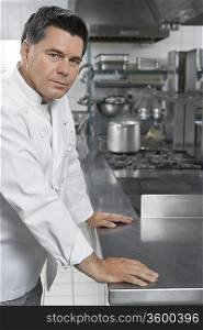 Male chef in kitchen, portrait