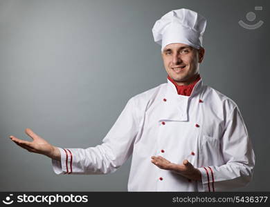 Male chef portrait against grey background