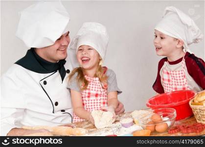 male chef tells the children something