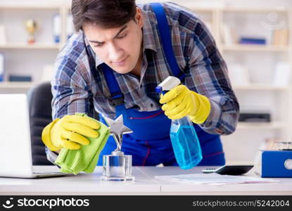 Male cleaner working in the office