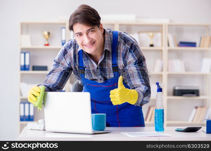 Male cleaner working in the office