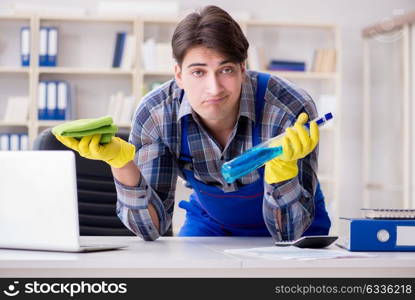 Male cleaner working in the office