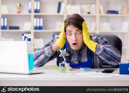 Male cleaner working in the office