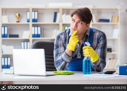 Male cleaner working in the office