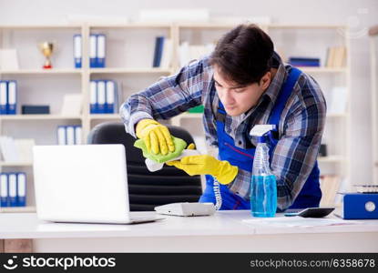 Male cleaner working in the office