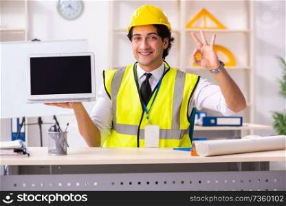 Male construction engineer working in the office 