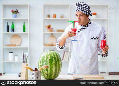 Male cook with watermelon in kitchen