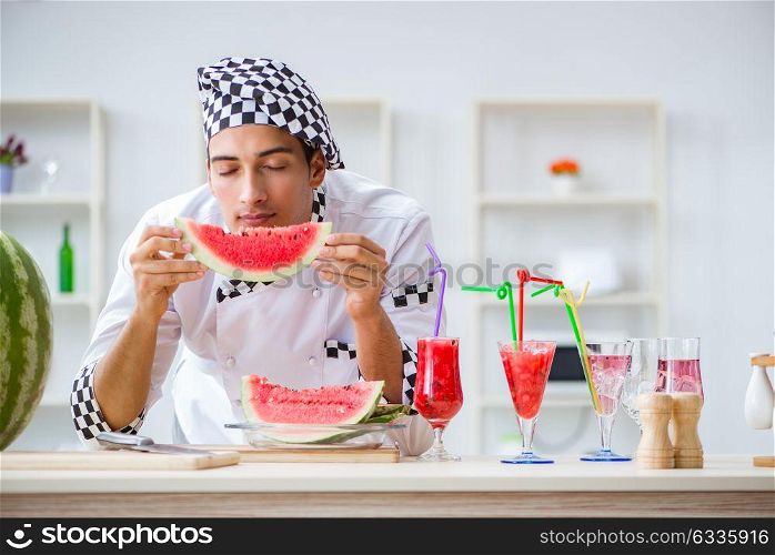 Male cook with watermelon in kitchen