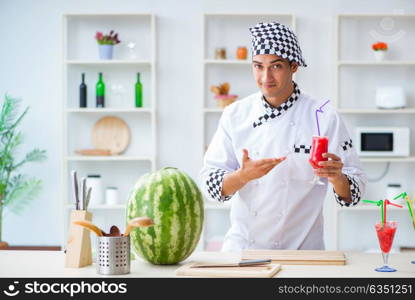 Male cook with watermelon in kitchen