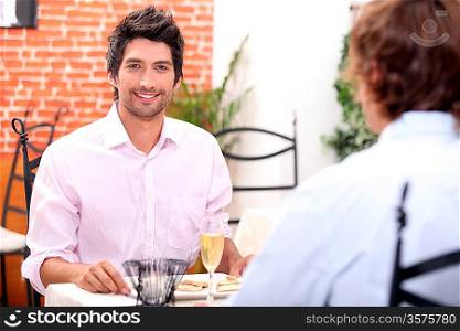 Male couple at restaurant