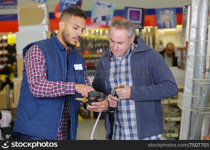 male customer in a hardware store with seller