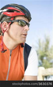 Male cyclist with helmet and sunglasses