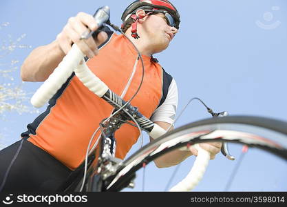 Male cyclist with metallic wheel rims