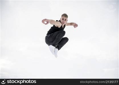 male dancer posing while mid air