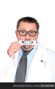 Male dentist holding picture of teeth