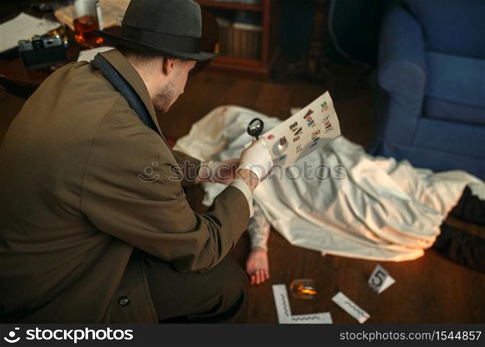 Male detective with magnifying glass looking killer&rsquo;s letter, evidence at the crime scene, retro style. Criminal investigation, inspector is working on a murder, vintage room interior on background. Detective with magnifying glass looking letter