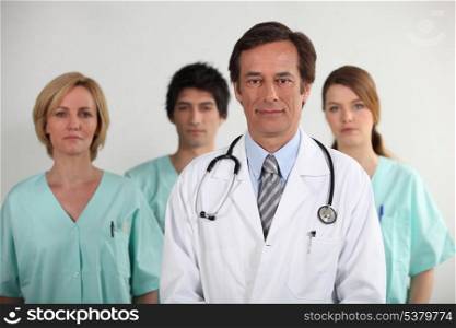 Male doctor and his nursing team