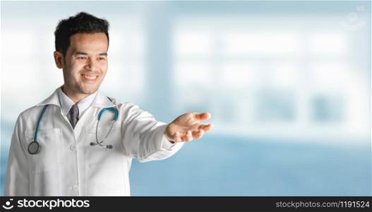 Male doctor at hospital opening hand palm to build copy space for your text and design. Medical healthcare business and doctor service.