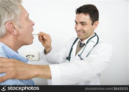 Male doctor examines senior patient