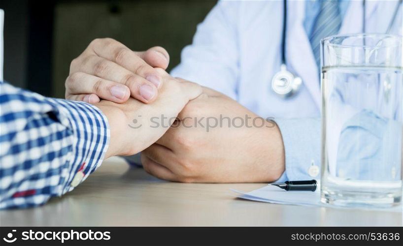 male doctor holding patient's hand, comforting patient who is in ambulance, helping concept.