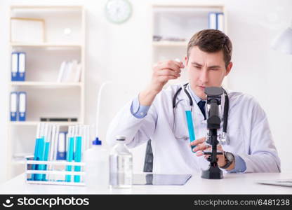 Male doctor looking at lab results in hospital