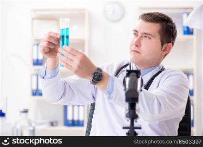 Male doctor looking at lab results in hospital