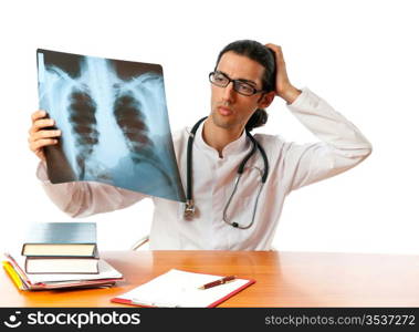 Male doctor looking at x-ray image