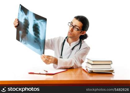 Male doctor looking at x-ray image