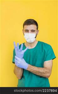 male doctor mask putting sterile gloves