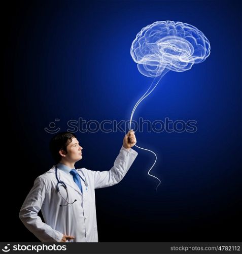 Male doctor neurologist. Image of young doctor neurologist against dark background