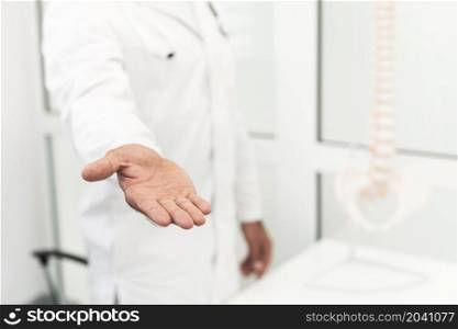 male doctor offering his hand