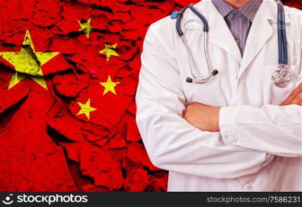 Male doctor on China flag background. Concept of corona virus.. Concept of corona virus.