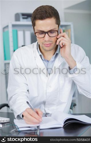 male doctor or medic speaking at phone