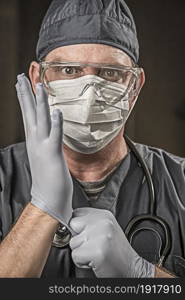 Male Doctor or Nurse Wearing Scrubs, Protective Face Mask and Goggles.