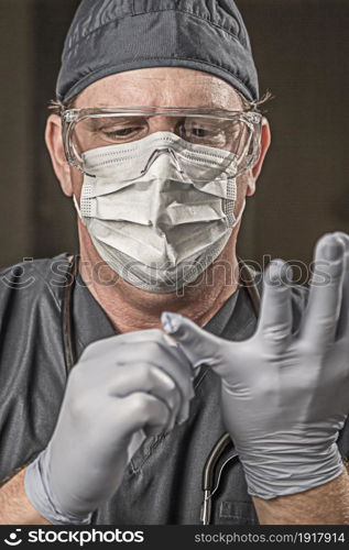 Male Doctor or Nurse Wearing Scrubs, Protective Face Mask and Goggles.