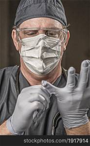 Male Doctor or Nurse Wearing Scrubs, Protective Face Mask and Goggles.