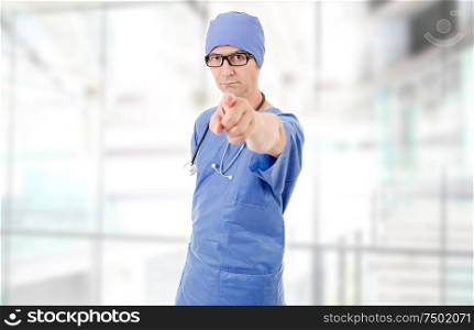 male doctor pointing at the hospital
