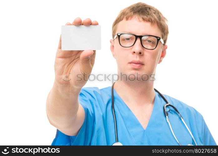 Male doctor shows a small blank for advertising focus on the hand